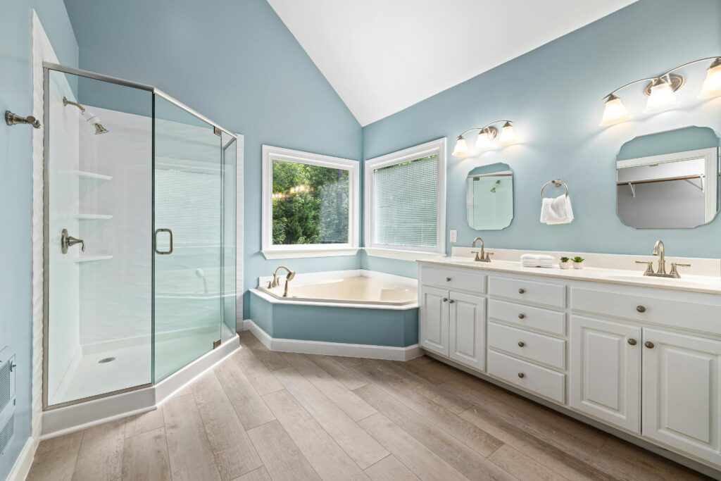 A newly remodeled bathroom complete with garden tub, walk-in shower, and premium flooring.